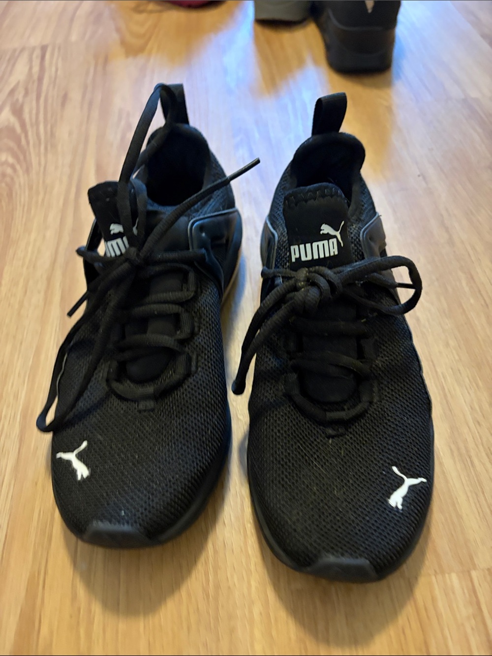 Puma women’s Black Mesh Athletic Sneakers with White Logo